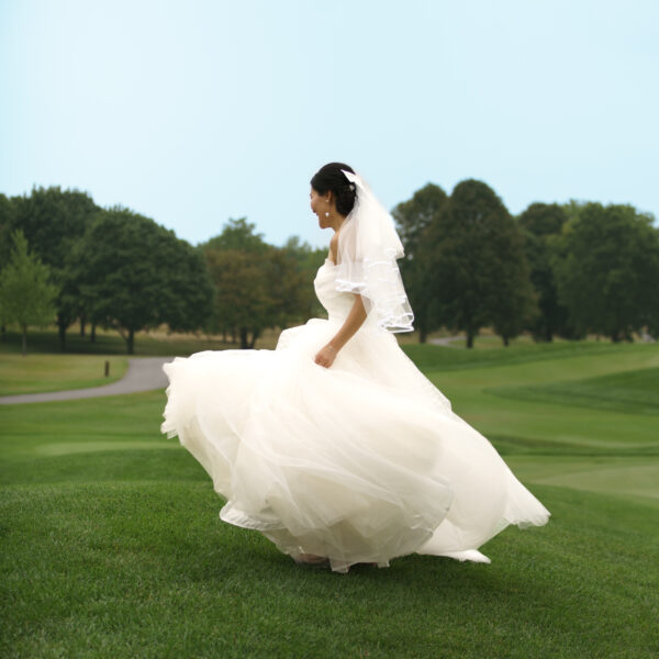 bride walking on the fairway