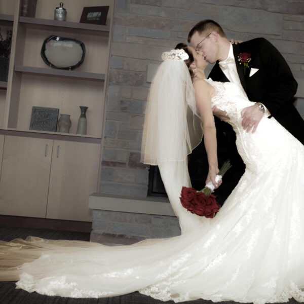bride and groom share a wedding day kiss